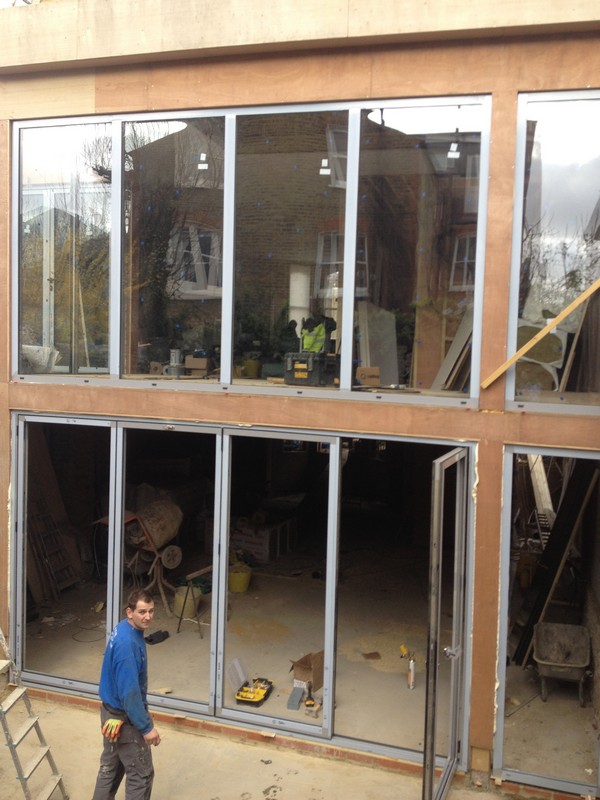 Aluminium bi-fold doors with two-storey glazing in Stockwell