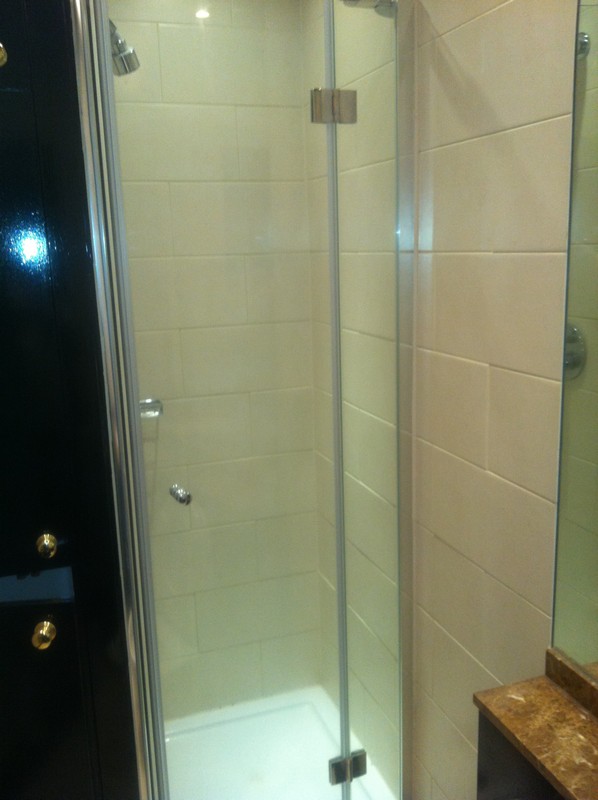 Frameless glass shower enclosure with chrome fittings in Stockwell